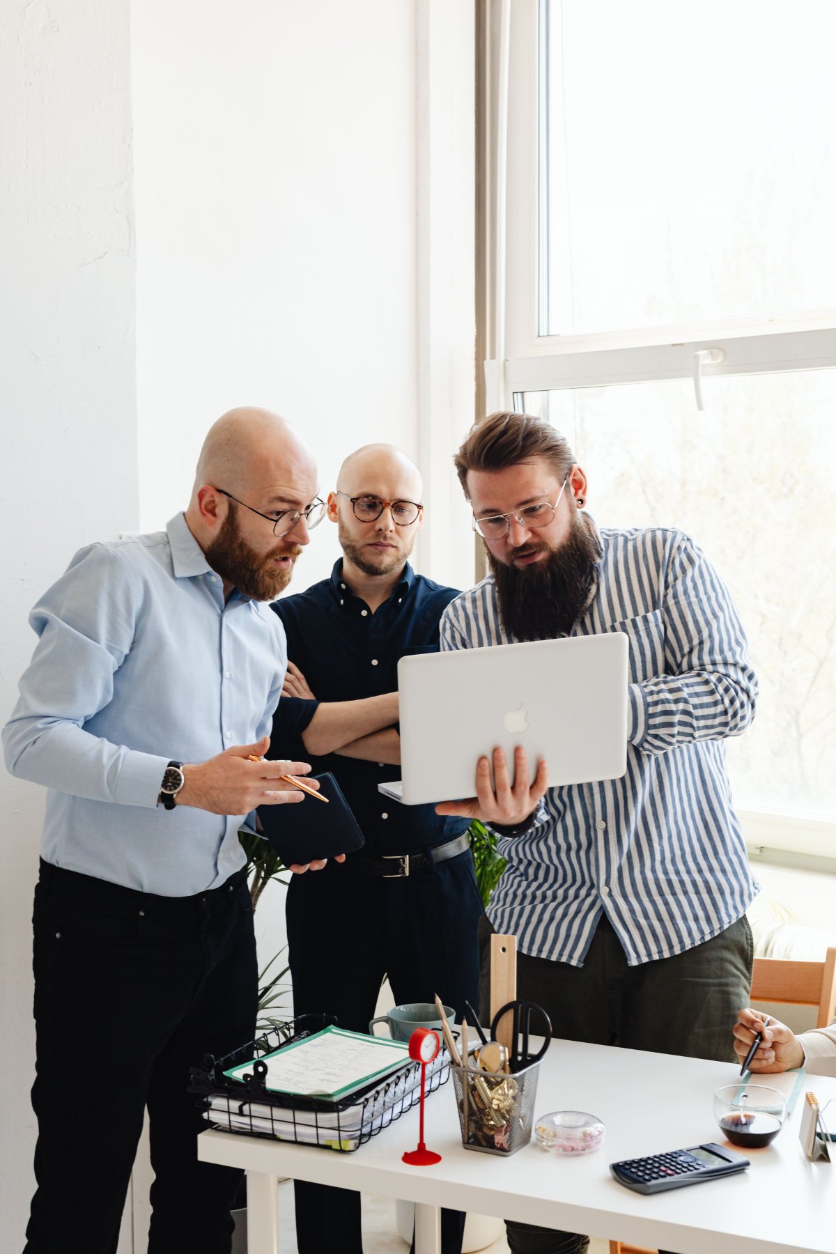 Colleagues reviewing information together on a laptop