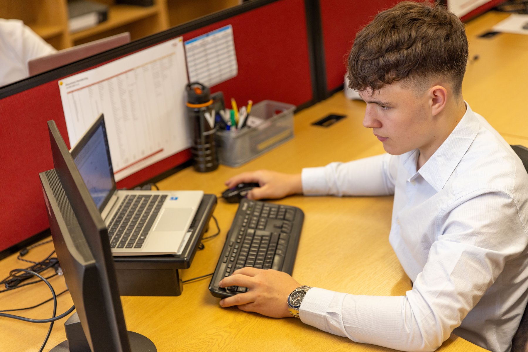 Engineer working at a multi-screen workstation
