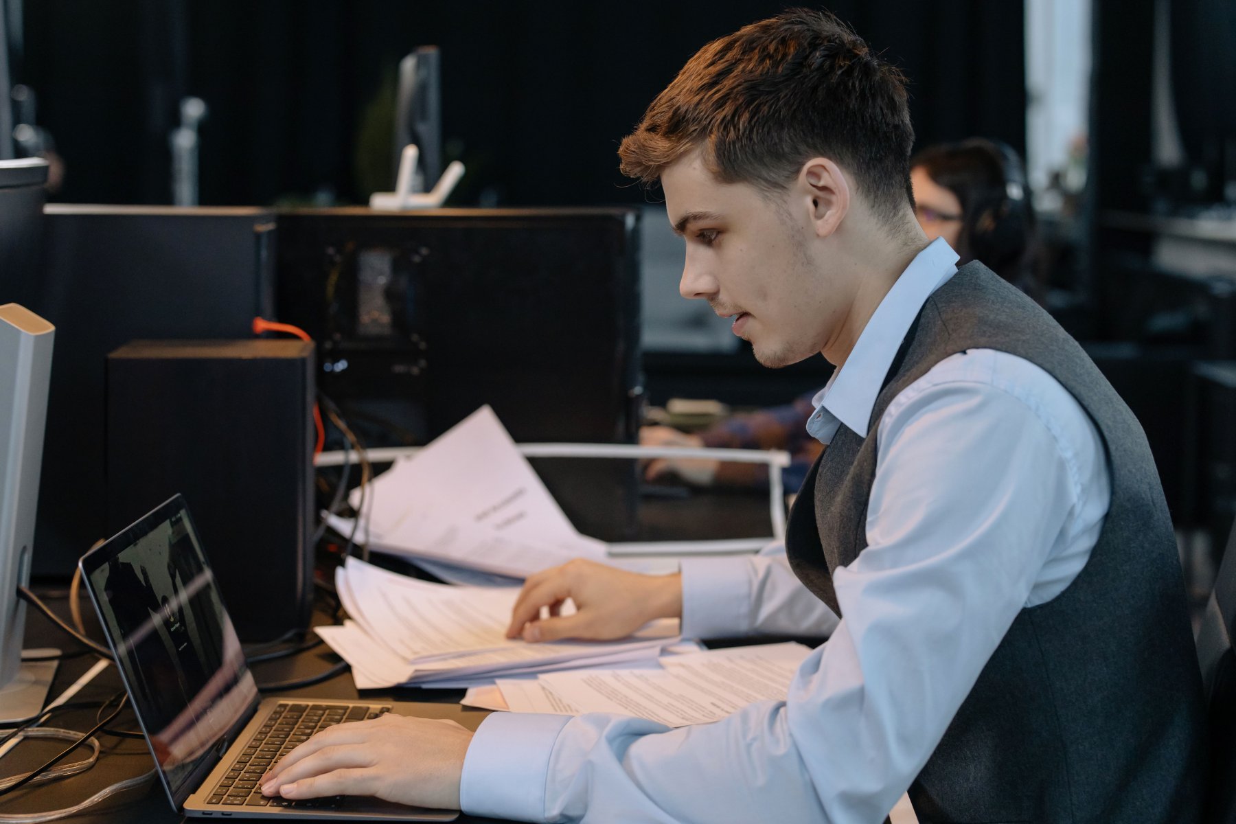 Professional working at a laptop in a studio